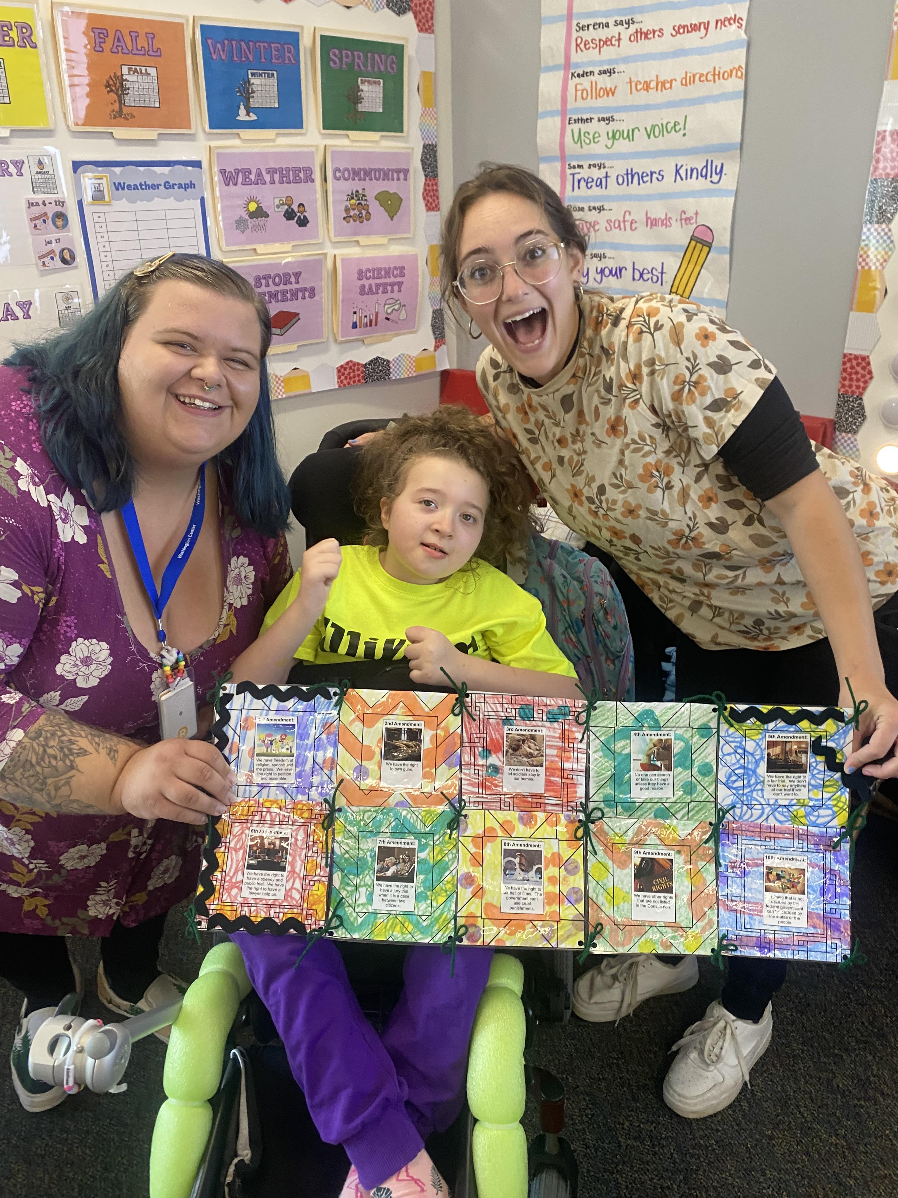 Rose displays her Bill of Rights quilt with Ms. Hannah and Ms. Olivia.